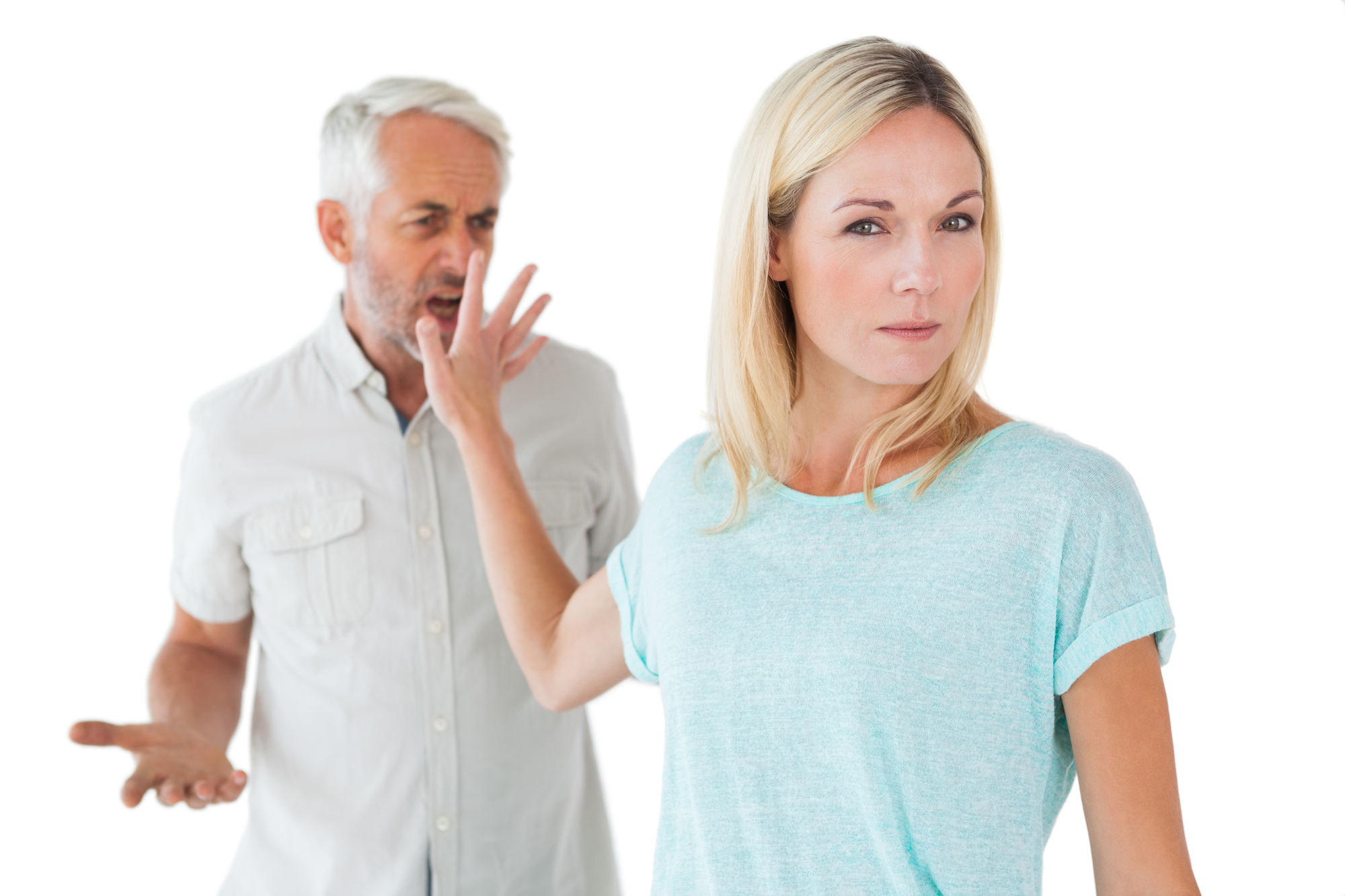 Woman not listening to her angry partner on white background