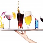 hand with tray full of alcohol drinks. celebration concept isolated